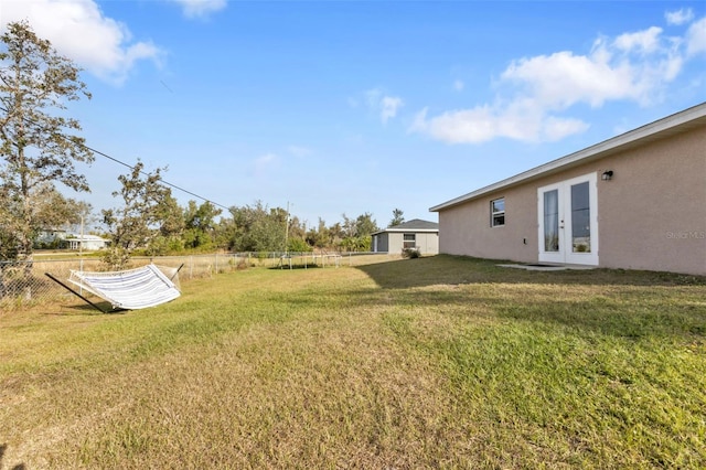 view of yard featuring french doors