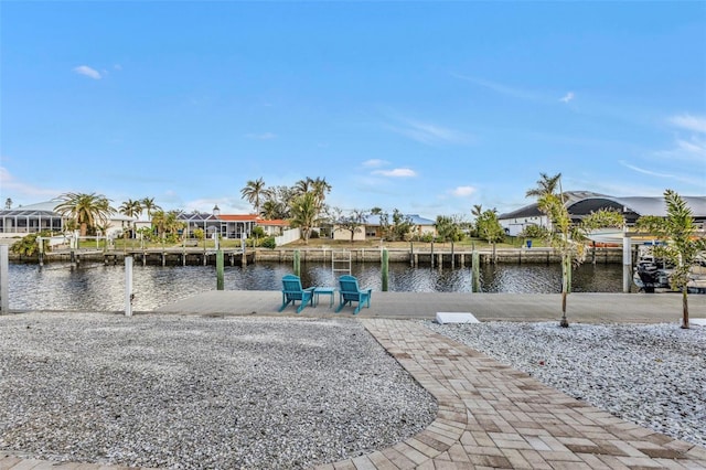 dock area with a water view and a patio area