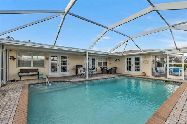 view of pool featuring a lanai, french doors, and a patio