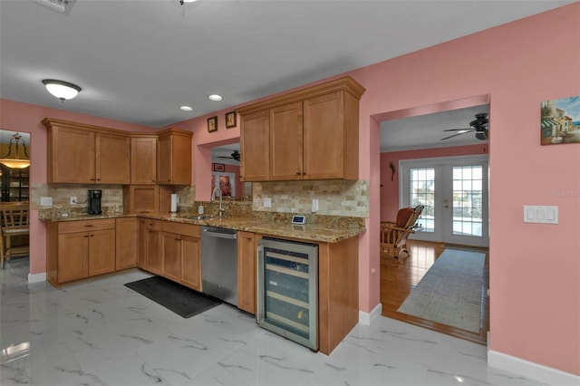 kitchen featuring stainless steel dishwasher, tasteful backsplash, wine cooler, and french doors