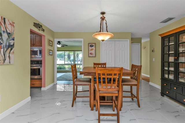 dining room with ceiling fan