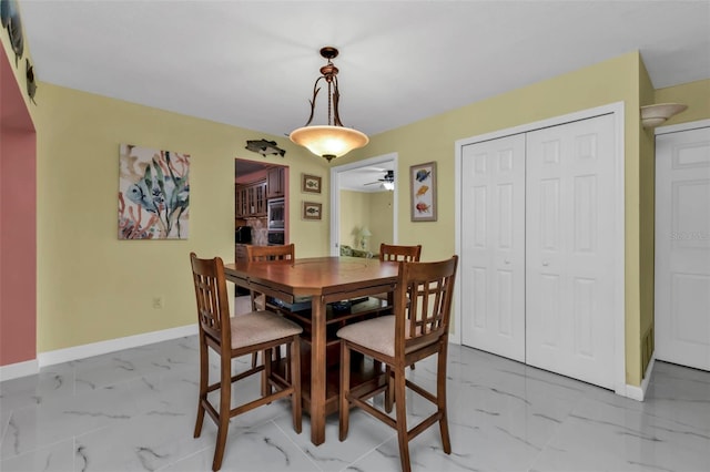 dining space with ceiling fan