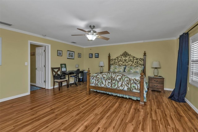 bedroom with hardwood / wood-style floors, ceiling fan, and ornamental molding