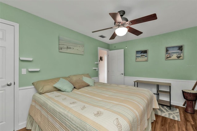 bedroom featuring wood-type flooring and ceiling fan