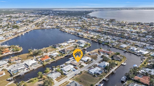 birds eye view of property featuring a water view