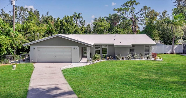 ranch-style home featuring a front lawn and a garage