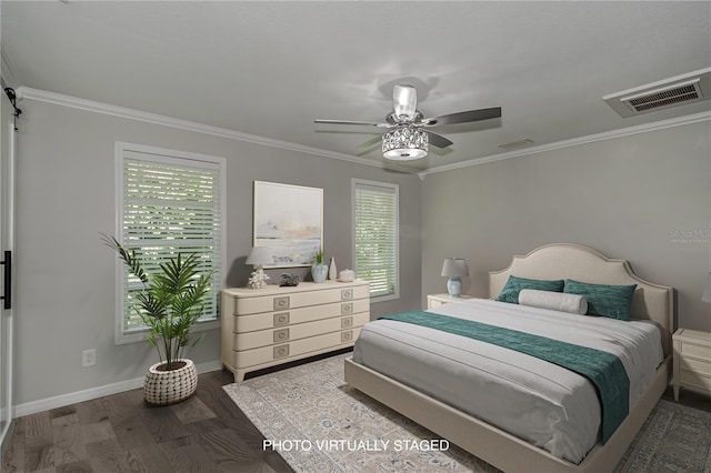 bedroom with multiple windows, ceiling fan, crown molding, and wood-type flooring