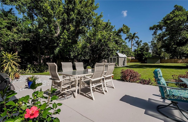 view of patio featuring a shed