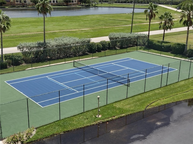 view of sport court featuring a water view and basketball hoop