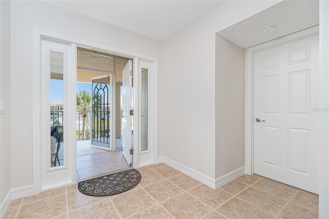 foyer featuring light tile patterned floors