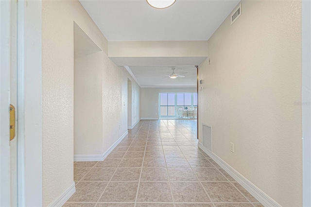 corridor with light tile patterned floors