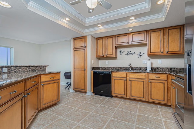 kitchen with a raised ceiling, dishwasher, dark stone counters, and crown molding