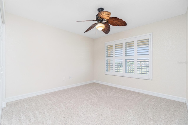 empty room featuring ceiling fan and carpet flooring