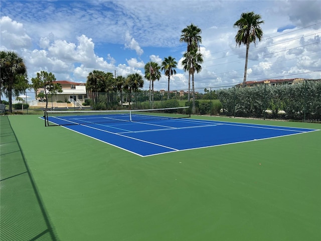 view of sport court with basketball hoop