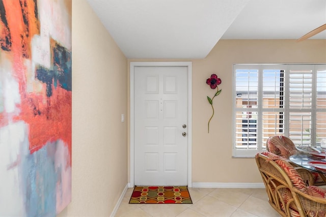 foyer with light tile patterned flooring