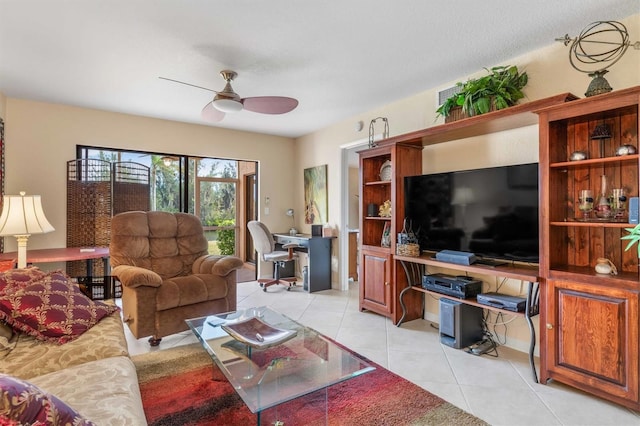 living room featuring ceiling fan and light tile patterned floors