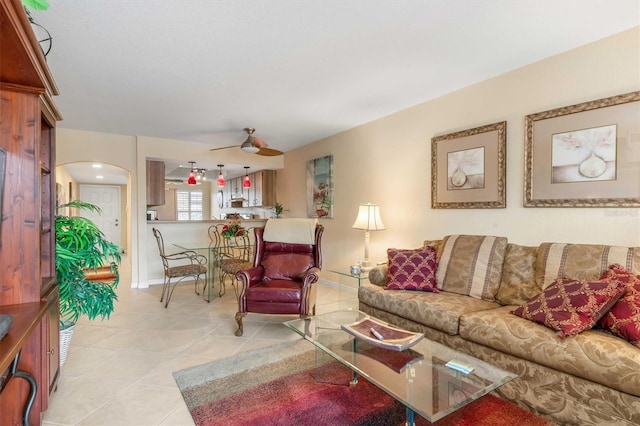 tiled living room featuring ceiling fan