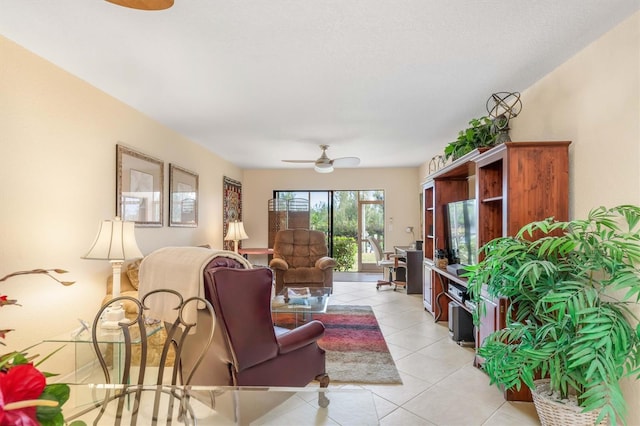 living room with ceiling fan and light tile patterned floors