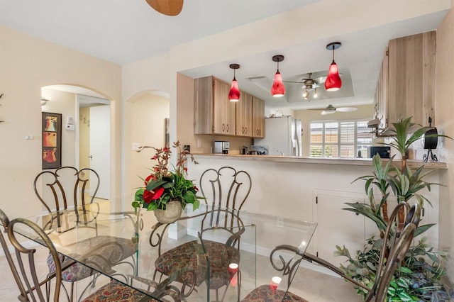 dining room with ceiling fan and light tile patterned floors