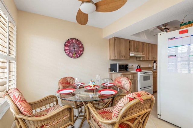 kitchen featuring white appliances and light tile patterned floors