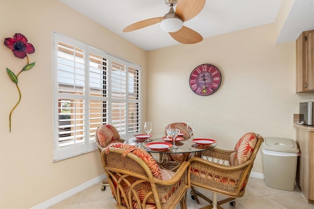 dining space with ceiling fan and light tile patterned floors