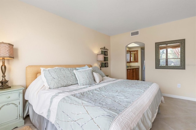 bedroom featuring ensuite bath