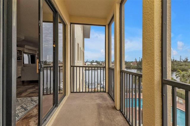 balcony featuring a water view