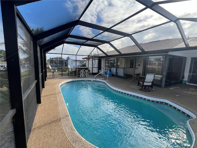 view of pool featuring a patio area and a lanai