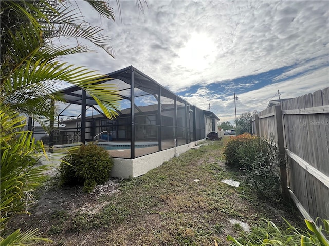 view of yard with a lanai