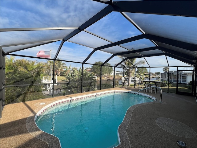 view of pool with a lanai and a patio area