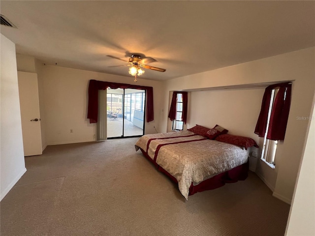 carpeted bedroom featuring ceiling fan and access to exterior