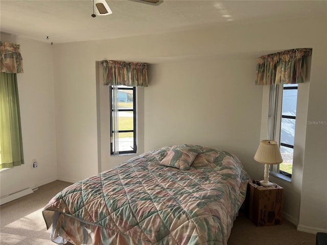 carpeted bedroom with ceiling fan