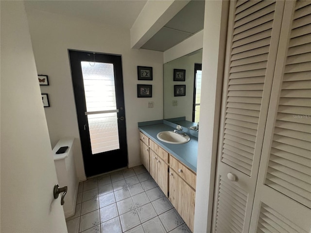 bathroom featuring tile patterned floors and vanity