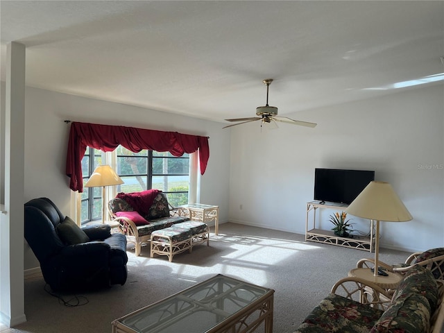 carpeted living room featuring ceiling fan