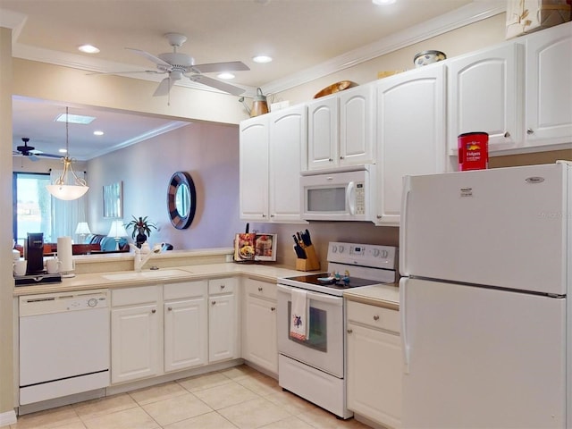 kitchen with sink, hanging light fixtures, light tile patterned floors, white appliances, and white cabinets