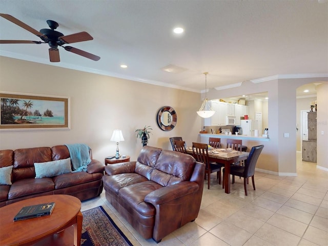 living room with ceiling fan, light tile patterned flooring, and crown molding