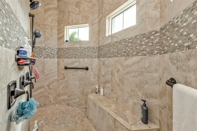 bathroom with a tile shower