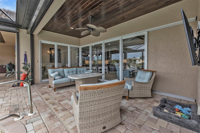 view of patio / terrace featuring ceiling fan and an outdoor living space