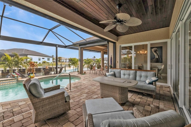 view of patio / terrace with ceiling fan, an outdoor hangout area, and a lanai