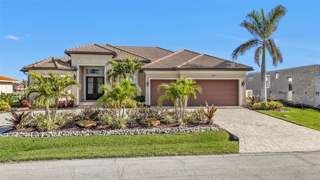 mediterranean / spanish house with a garage