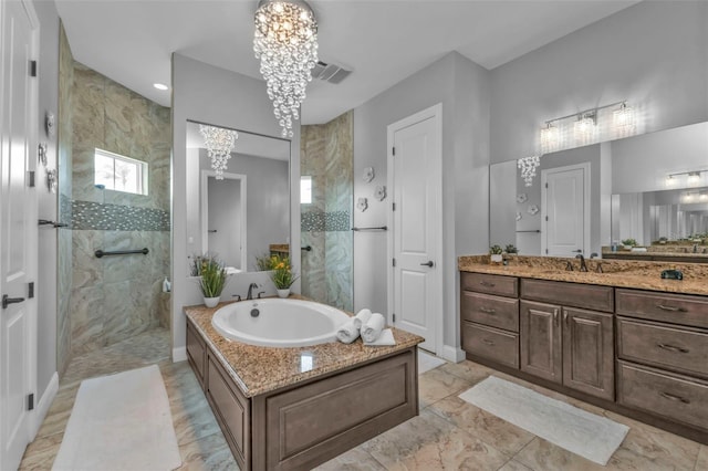 bathroom with vanity, separate shower and tub, and a notable chandelier