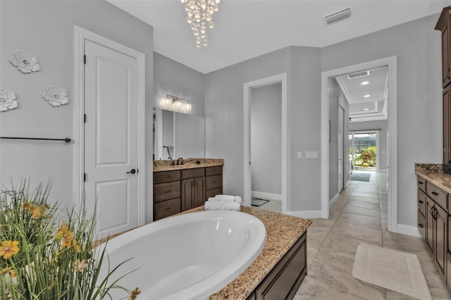 bathroom featuring vanity and a bath