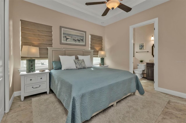 bedroom with ensuite bathroom and ceiling fan