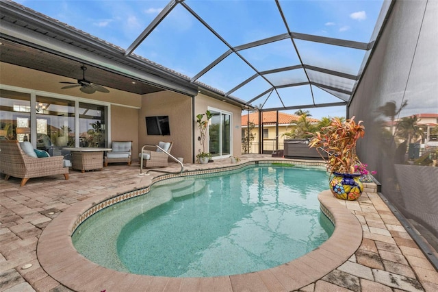 view of pool with a jacuzzi, a lanai, an outdoor hangout area, ceiling fan, and a patio area