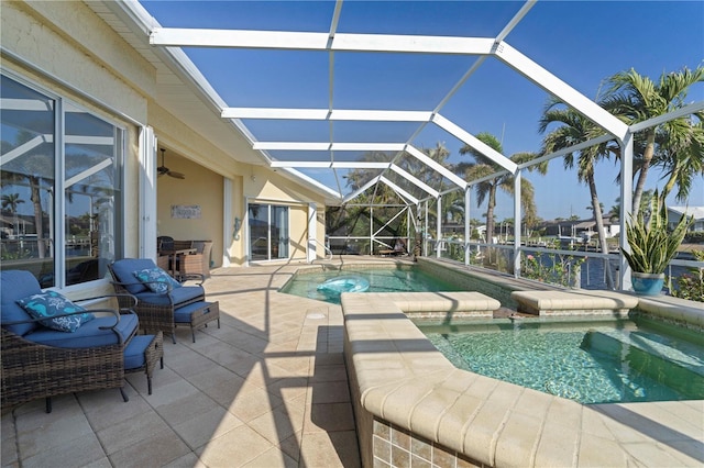 view of pool featuring a patio area and glass enclosure