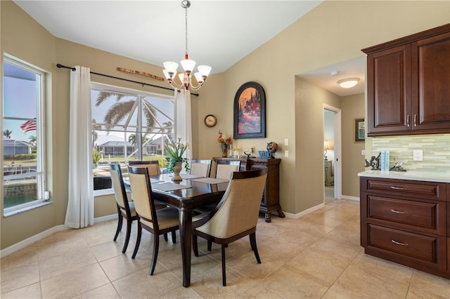 dining room featuring a notable chandelier and light tile patterned floors