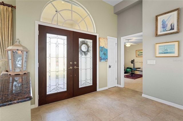 entrance foyer with french doors and ceiling fan