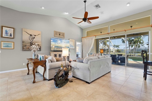 living room with ceiling fan, light tile patterned flooring, and lofted ceiling