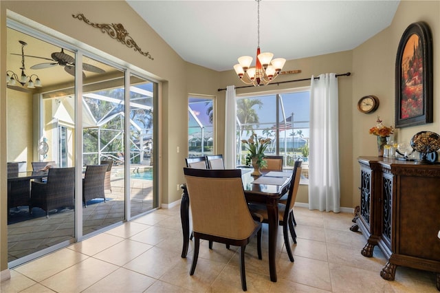 dining area with lofted ceiling, light tile patterned flooring, and ceiling fan with notable chandelier