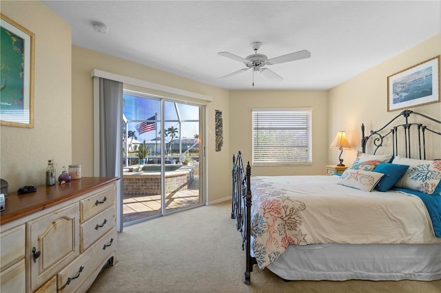 carpeted bedroom with access to outside and ceiling fan